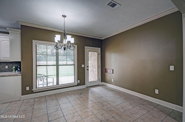 127 Rockbridge Cir, Clinton, MS 39056 - unfurnished dining area with light tile patterned flooring, a chandelier, and crown molding