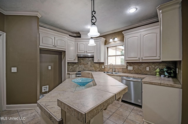127 Rockbridge Cir, Clinton, MS 39056 - kitchen featuring dishwasher, tile countertops, decorative backsplash, a center island, and pendant lighting