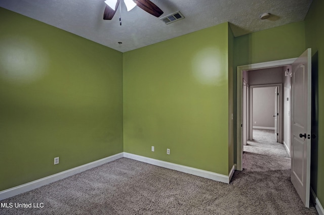 127 Rockbridge Cir, Clinton, MS 39056 - carpeted empty room with a ceiling fan and a textured ceiling