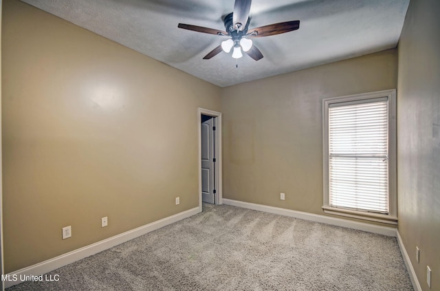 127 Rockbridge Cir, Clinton, MS 39056 - empty room with a ceiling fan, carpet floors, healthy amount of natural light, and a textured ceiling