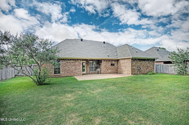 127 Rockbridge Cir, Clinton, MS 39056 - back of property with a patio, a fenced backyard, brick siding, and a shingled roof