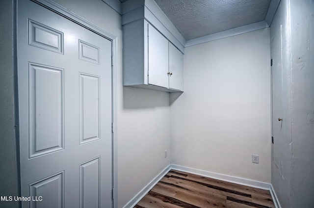 226 N Shenandoah Rd, Brandon, MS 39047 - washroom featuring dark wood-style flooring and a textured ceiling