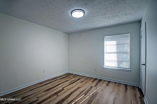 226 N Shenandoah Rd, Brandon, MS 39047 - spare room with wood finished floors and a textured ceiling
