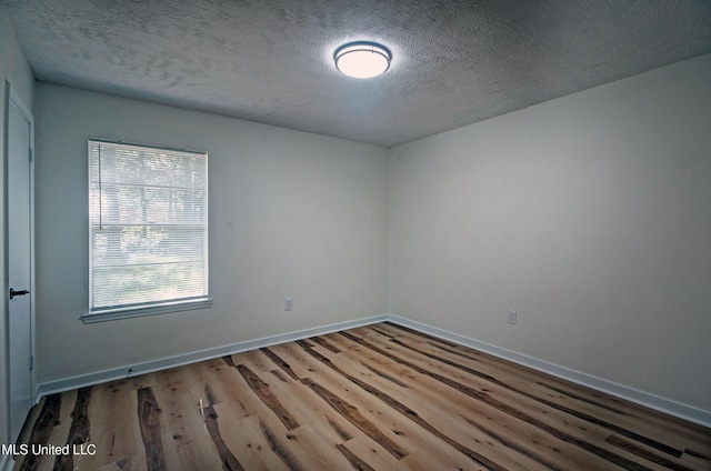 226 N Shenandoah Rd, Brandon, MS 39047 - empty room featuring wood finished floors and a textured ceiling