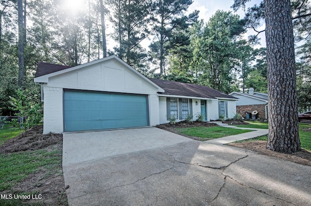 226 N Shenandoah Rd, Brandon, MS 39047 - ranch-style home featuring brick siding, an attached garage, driveway, and a shingled roof