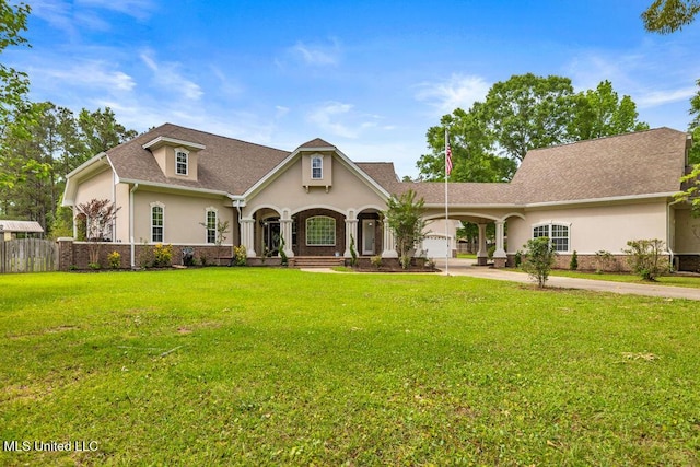 17000 River Pl, Vancleave, MS 39565 - view of front facade featuring stucco siding, concrete driveway, and roof with shingles