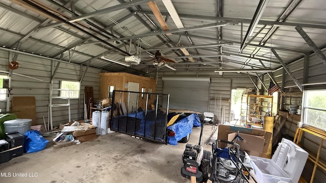 17000 River Pl, Vancleave, MS 39565 - garage featuring a garage door opener and metal wall