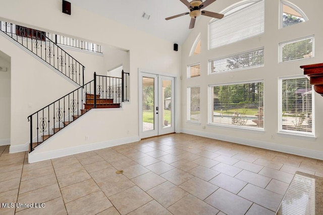 17000 River Pl, Vancleave, MS 39565 - unfurnished living room featuring high vaulted ceiling, ceiling fan, baseboards, light tile patterned floors, and stairs