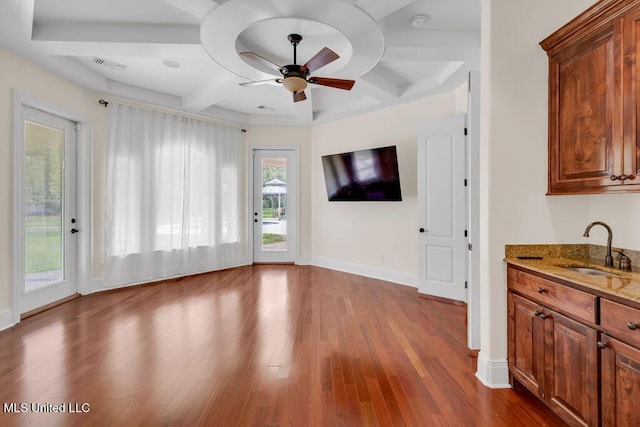 17000 River Pl, Vancleave, MS 39565 - unfurnished living room featuring a sink, coffered ceiling, ceiling fan, wood finished floors, and beam ceiling