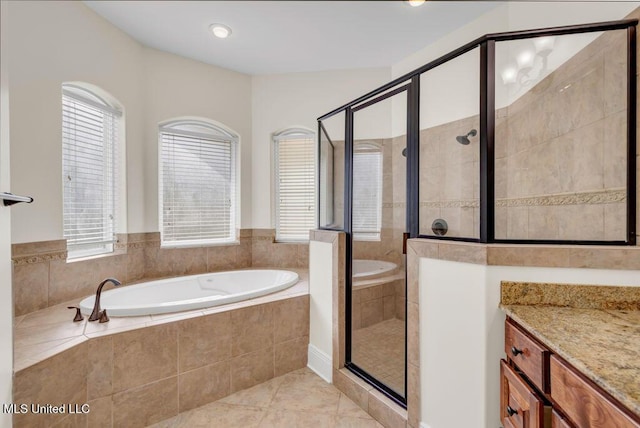 17000 River Pl, Vancleave, MS 39565 - bathroom featuring a stall shower, healthy amount of natural light, a garden tub, and tile patterned flooring