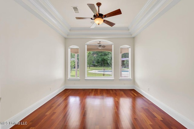 17000 River Pl, Vancleave, MS 39565 - empty room featuring ornamental molding, a ceiling fan, a raised ceiling, wood finished floors, and baseboards