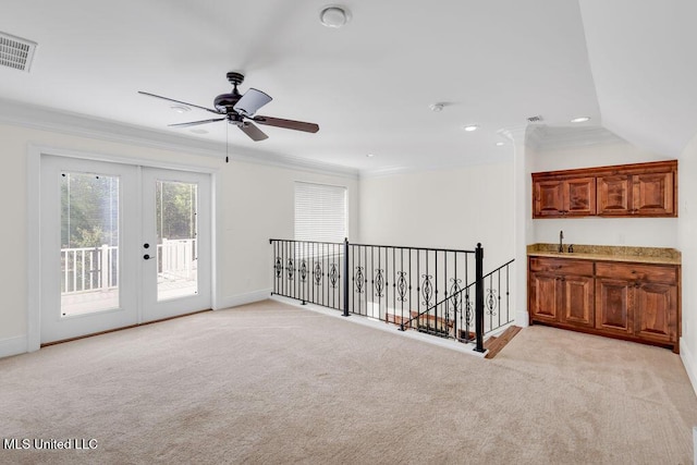 17000 River Pl, Vancleave, MS 39565 - spare room with light colored carpet, ornamental molding, recessed lighting, wet bar, and a ceiling fan