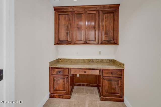 17000 River Pl, Vancleave, MS 39565 - unfurnished office featuring built in desk, baseboards, and light carpet