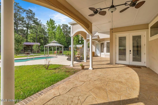 17000 River Pl, Vancleave, MS 39565 - view of patio featuring french doors, a gazebo, a ceiling fan, and an outdoor pool