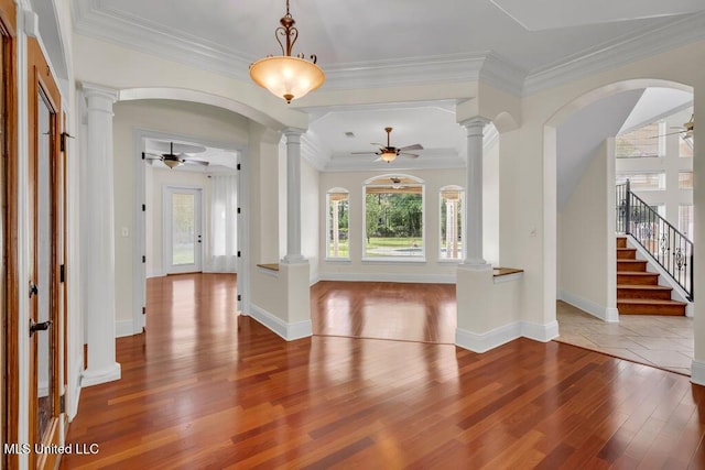17000 River Pl, Vancleave, MS 39565 - foyer featuring ceiling fan, decorative columns, plenty of natural light, and ornamental molding