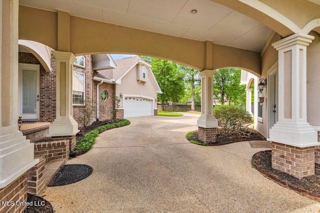 17000 River Pl, Vancleave, MS 39565 - view of patio / terrace with a garage and driveway