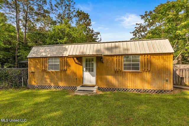 17000 River Pl, Vancleave, MS 39565 - view of front facade featuring entry steps, metal roof, and an outdoor structure