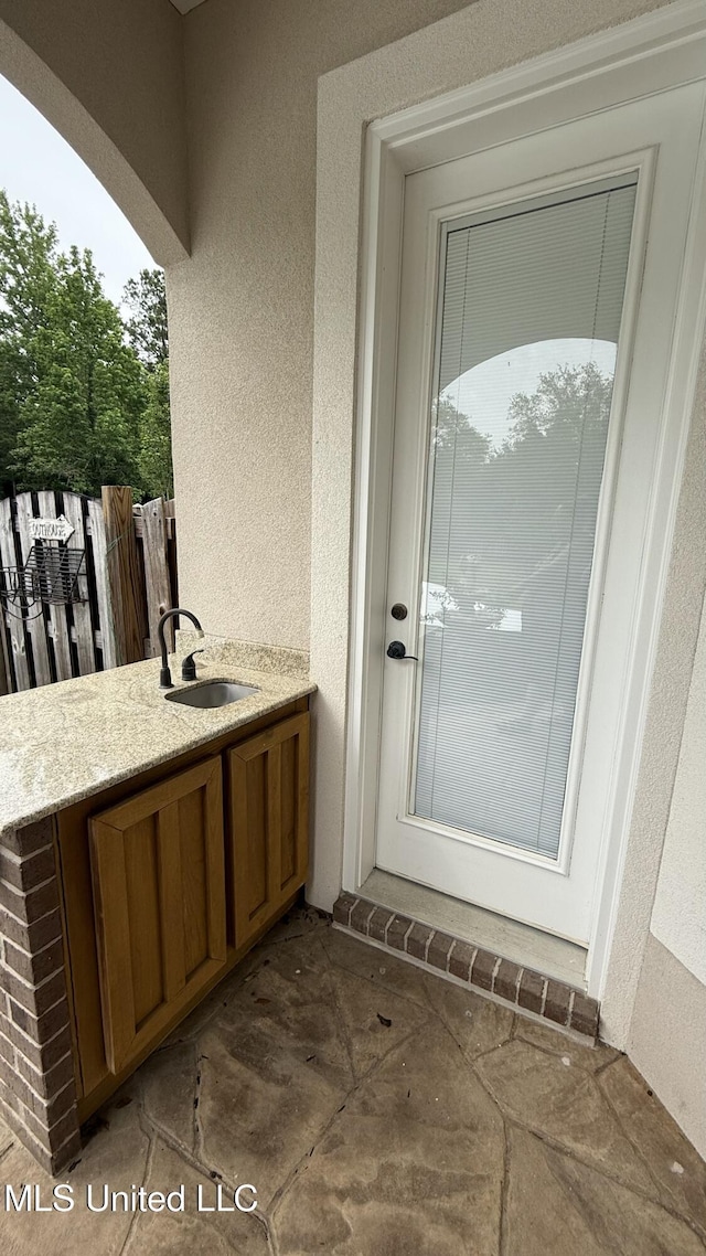 17000 River Pl, Vancleave, MS 39565 - entrance to property featuring a sink and stucco siding