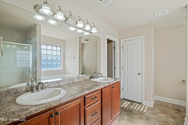 bathroom featuring vanity and shower with separate bathtub