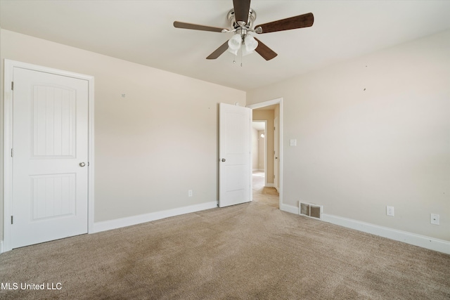 carpeted empty room with ceiling fan