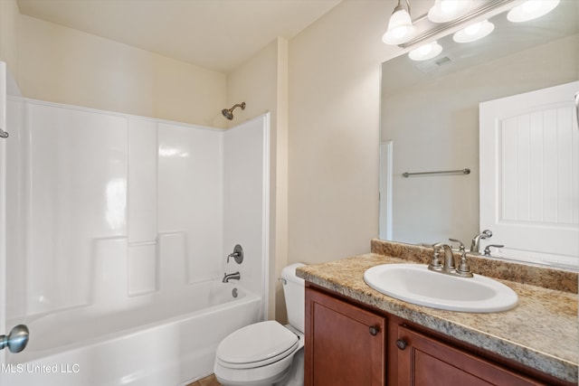 full bathroom featuring shower / bathing tub combination, vanity, and toilet