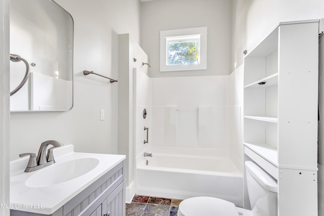 full bathroom with vanity, washtub / shower combination, and toilet