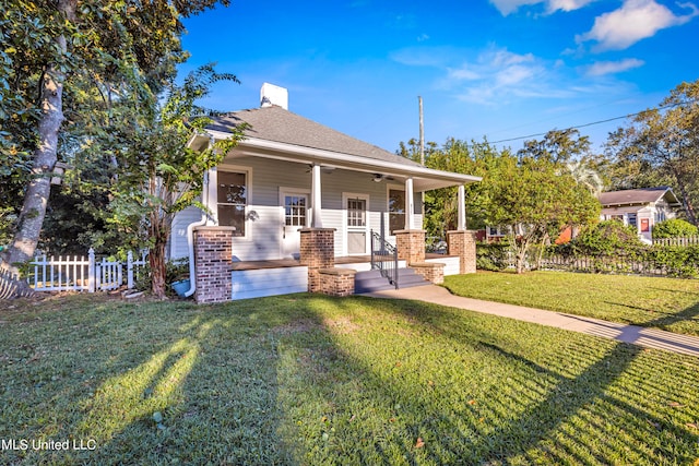 view of front facade with a front yard and a porch