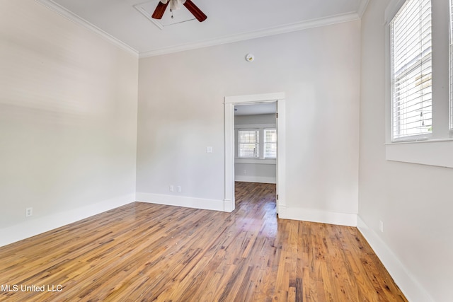 unfurnished room featuring ceiling fan, ornamental molding, and hardwood / wood-style floors