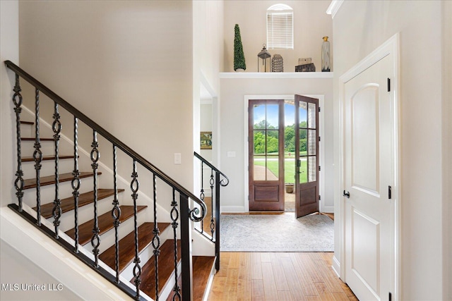 8063 Elizabeth Dr, Olive Branch, MS 38654 - entrance foyer with a towering ceiling, wood finished floors, baseboards, and stairway