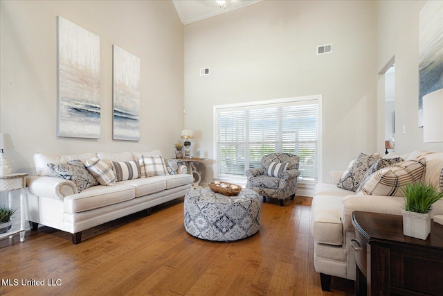 8063 Elizabeth Dr, Olive Branch, MS 38654 - living room with a towering ceiling, wood finished floors, and crown molding