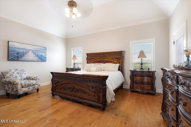 8063 Elizabeth Dr, Olive Branch, MS 38654 - bedroom featuring lofted ceiling, light wood finished floors, multiple windows, and baseboards
