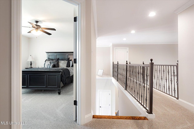 8063 Elizabeth Dr, Olive Branch, MS 38654 - corridor featuring carpet floors, an upstairs landing, ornamental molding, recessed lighting, and baseboards