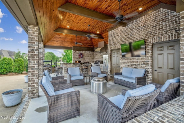 8063 Elizabeth Dr, Olive Branch, MS 38654 - view of patio featuring outdoor lounge area, an outdoor kitchen, and a ceiling fan