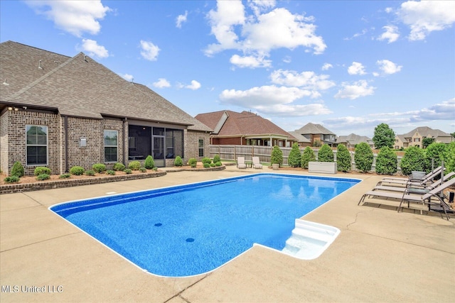8063 Elizabeth Dr, Olive Branch, MS 38654 - view of pool with a patio area, a sunroom, and a residential view