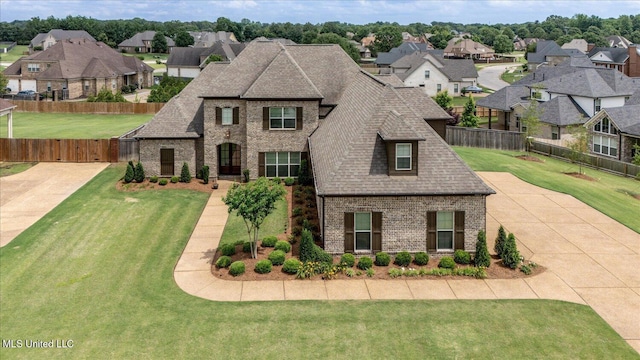 8063 Elizabeth Dr, Olive Branch, MS 38654 - french country home with brick siding, a shingled roof, and a residential view
