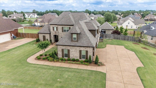 8063 Elizabeth Dr, Olive Branch, MS 38654 - french country home with brick siding, a residential view, and a shingled roof