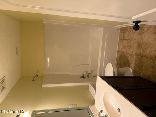 7497 Redberry Dr, Horn Lake, MS 38637 - bathroom featuring shower / bathtub combination, toilet, and vanity