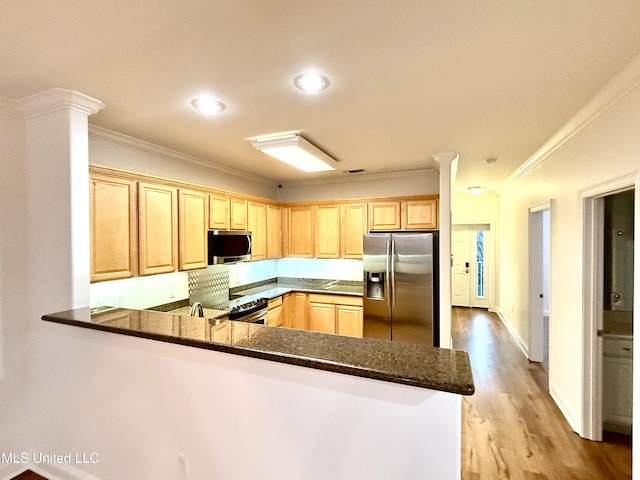 kitchen with light wood-type flooring, light brown cabinetry, stainless steel appliances, a peninsula, and crown molding