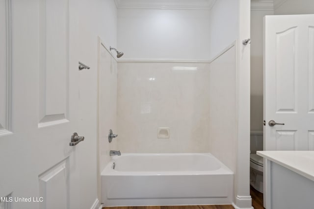 full bath with vanity, crown molding, toilet, and shower / bathtub combination