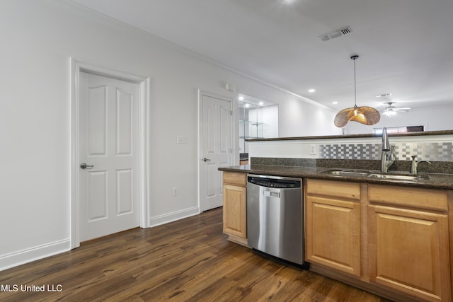 kitchen featuring dark stone countertops, dark wood-style floors, visible vents, a sink, and stainless steel dishwasher