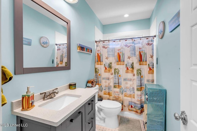 bathroom featuring shower / bath combo, vanity, and toilet