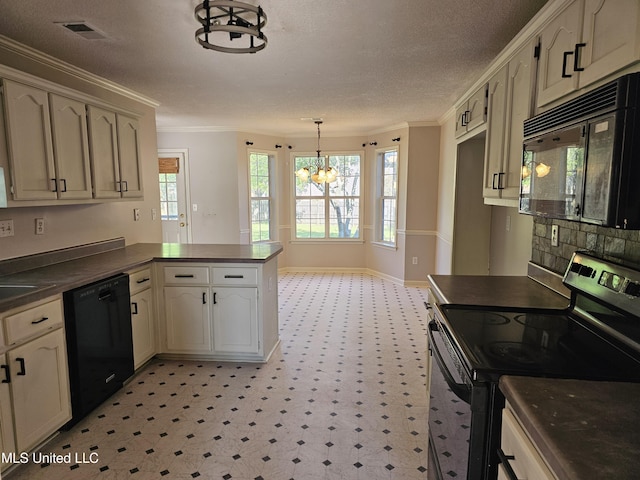 5746 Eagleston Dr, Olive Branch, MS 38654 - kitchen featuring an inviting chandelier, a peninsula, crown molding, dark countertops, and black appliances