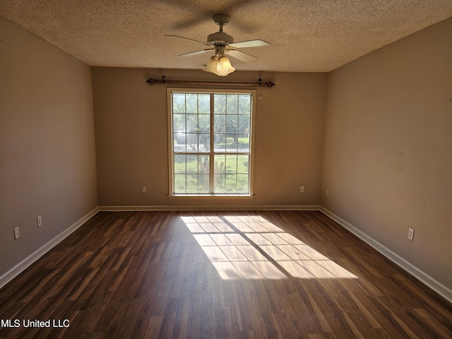 5746 Eagleston Dr, Olive Branch, MS 38654 - spare room with a textured ceiling, ceiling fan, baseboards, and dark wood-style floors