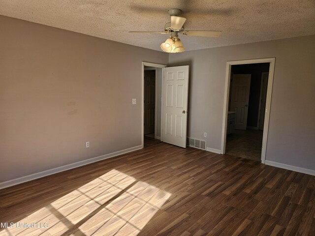 5746 Eagleston Dr, Olive Branch, MS 38654 - empty room featuring visible vents, baseboards, a ceiling fan, and dark wood finished floors