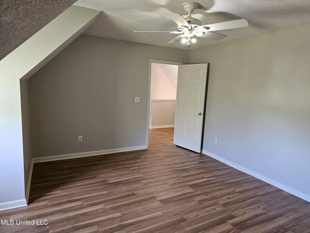 5746 Eagleston Dr, Olive Branch, MS 38654 - additional living space with a textured ceiling, wood finished floors, ceiling fan, and baseboards