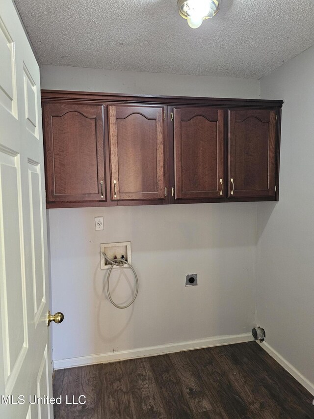 5746 Eagleston Dr, Olive Branch, MS 38654 - washroom featuring electric dryer hookup, baseboards, dark wood-style floors, hookup for a washing machine, and cabinet space