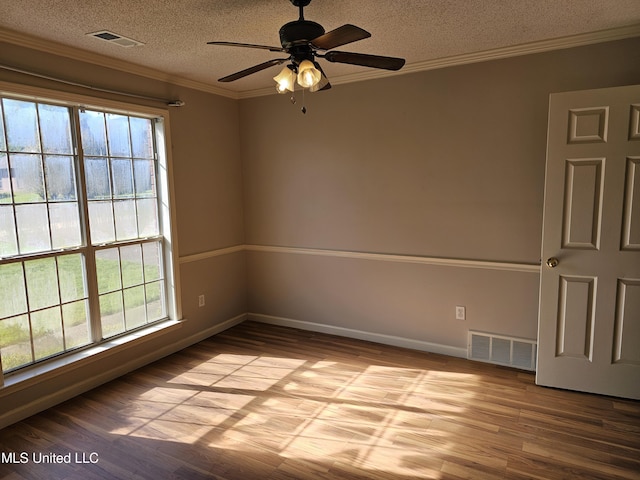 5746 Eagleston Dr, Olive Branch, MS 38654 - unfurnished room with visible vents, a ceiling fan, wood finished floors, and a textured ceiling