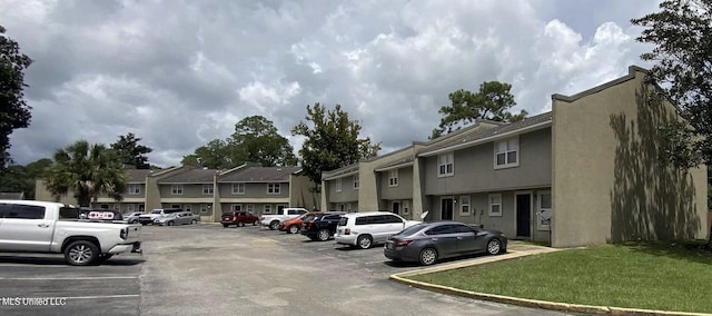 1625 Martin Bluff Rd Unit 97, Gautier, MS 39553 - uncovered parking lot featuring a residential view
