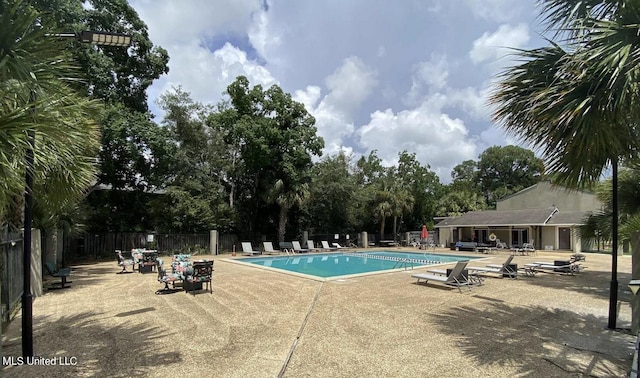 view of swimming pool with a patio area