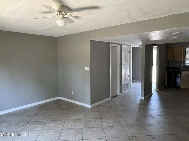 1625 Martin Bluff Rd Unit 97, Gautier, MS 39553 - unfurnished room featuring light tile patterned floors, a ceiling fan, and baseboards